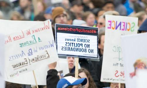 Signs at pro-science rally