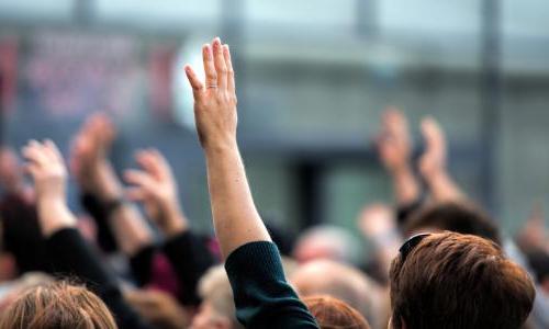 People raising their hands